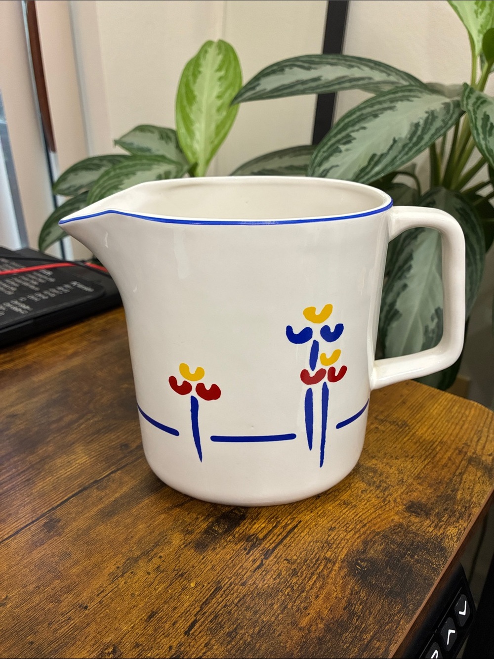 Riva Designs White Ceramic Pitcher with Blue Trim and Red & Yellow Floral Motifs